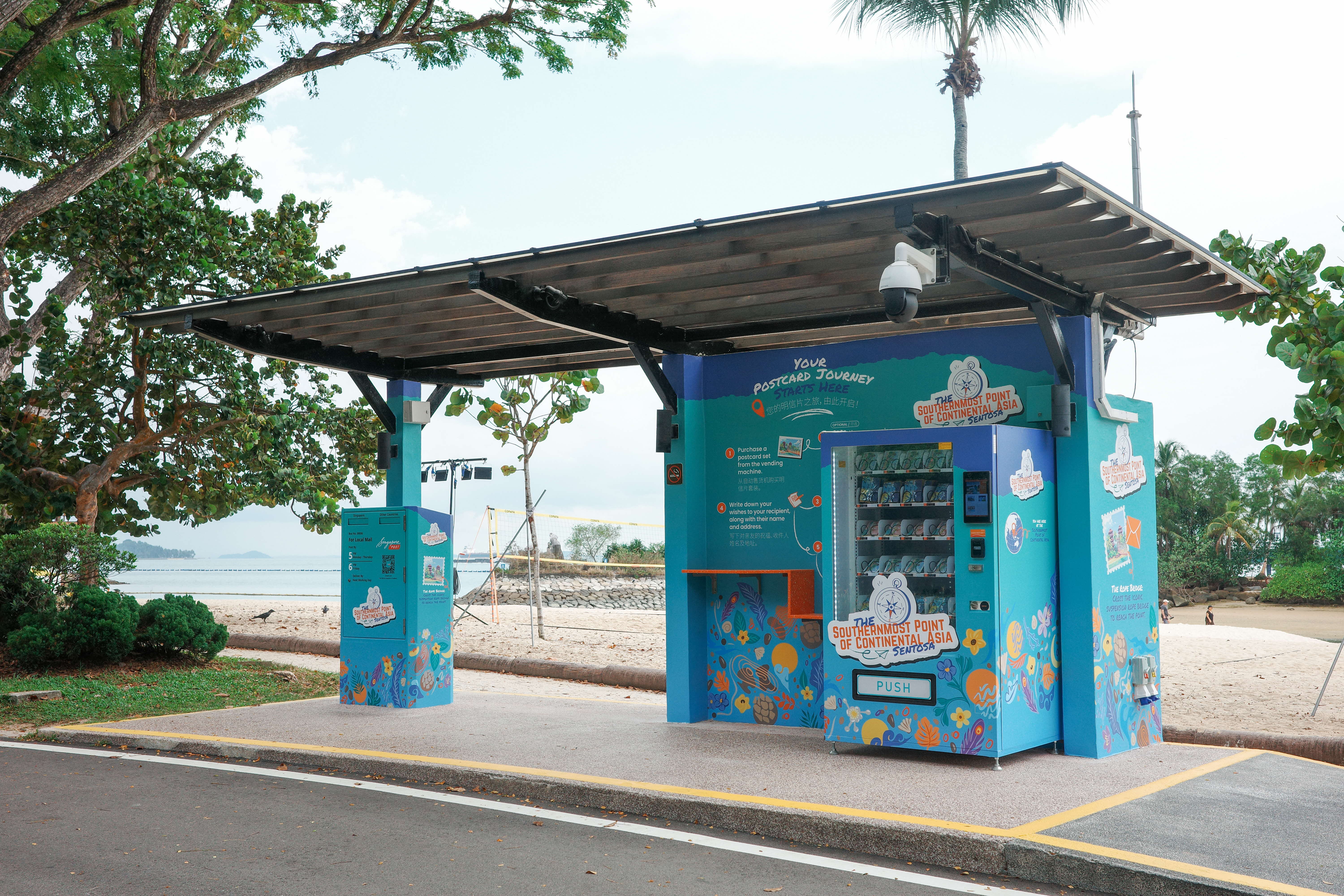 A vending machine sheltered by a roof on the beach